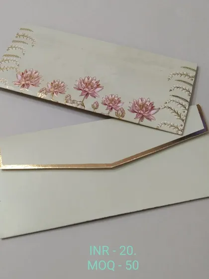 An elegant off-white money envelope with a simple design of pink lotus flowers and gold foil accents. The look is clean, modern, and sophisticated.