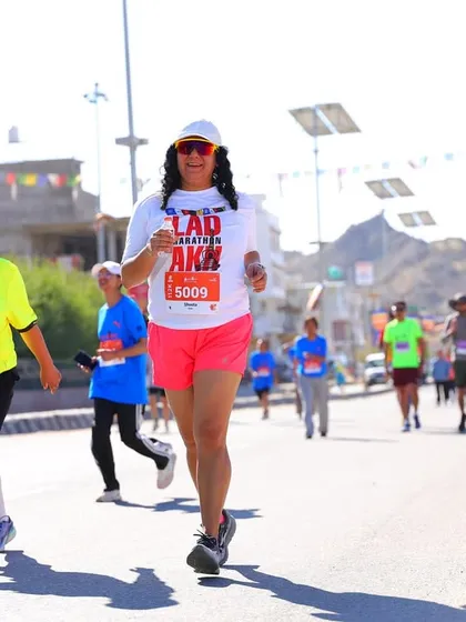 An athlete in her element during the Ladakh Marathon. We train to maintain form and pace even at high altitudes and through long distances.