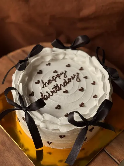 Another look at the popular Pinterest-inspired bow cake, a favorite for birthdays and bridal showers.