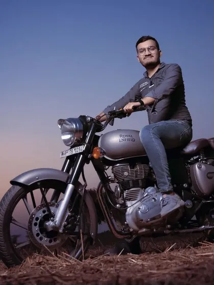 A pre-wedding portrait session with a Royal Enfield during the golden hour. These shoots are a great way to capture your personality in a relaxed, outdoor setting before the main events.