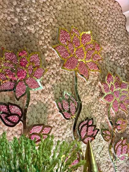 A macro shot of the crystal-studded lotus motifs on the mandap backdrop. This level of intricate detail is what sets our designs apart, adding a touch of sparkle and luxury. ✨