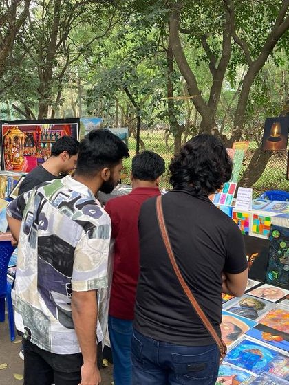 A crowd of people browsing the art at my Chitra Santhe stall.