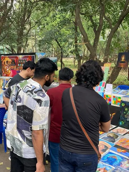 A crowd of people browsing the art at my Chitra Santhe stall.