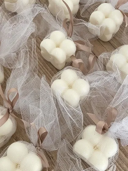 For a simple and elegant look, we can pack our bubble candles in these net potlis with a ribbon. It's a beautiful and affordable packaging option.