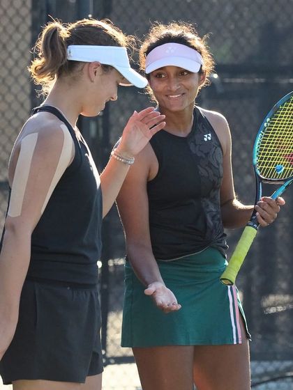 A moment of sportsmanship and camaraderie between Sahaja and her doubles partner at the ITF W100 Charleston event.