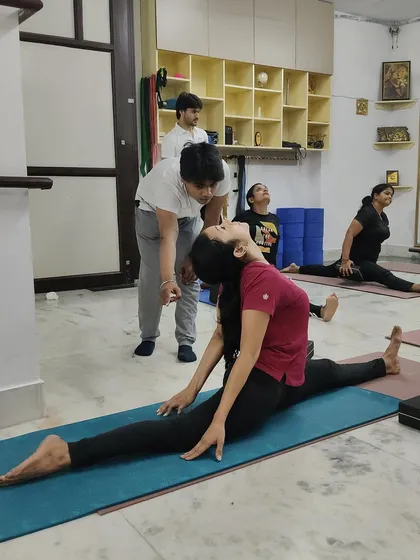Achieving advanced postures like the splits (Hanumanasana) requires patience and proper guidance. I provide hands-on adjustments to ensure you progress safely, respecting your body's limits while gently encouraging you to explore them.