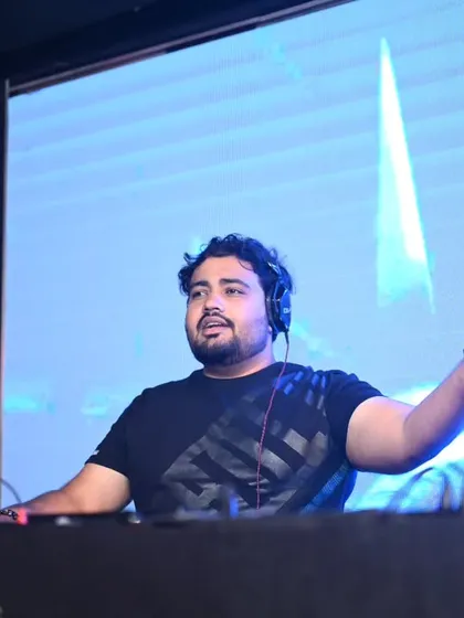In my element, reading the crowd and lining up the next track. A great corporate DJ knows how to connect with the audience, and for me, it's all about that interaction from behind the console.