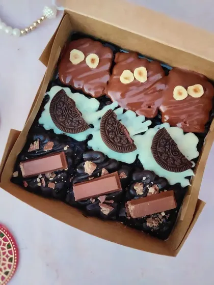 My assorted brownie box is always a hit. This box includes three of my most-loved flavors: rich Nutella Hazelnut, creamy White Chocolate-Oreo, and crunchy KitKat brownies, all freshly baked and ready to be gifted.