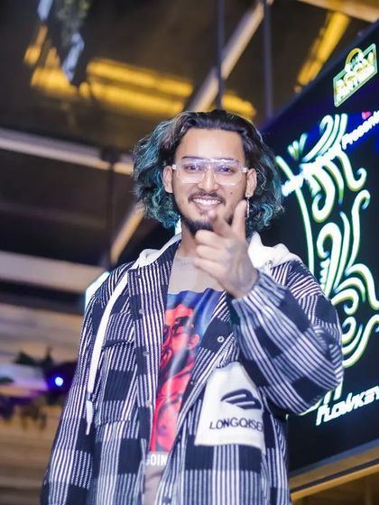 A confident shot from the DJ booth. I'm here to get the party started and keep it going all night.