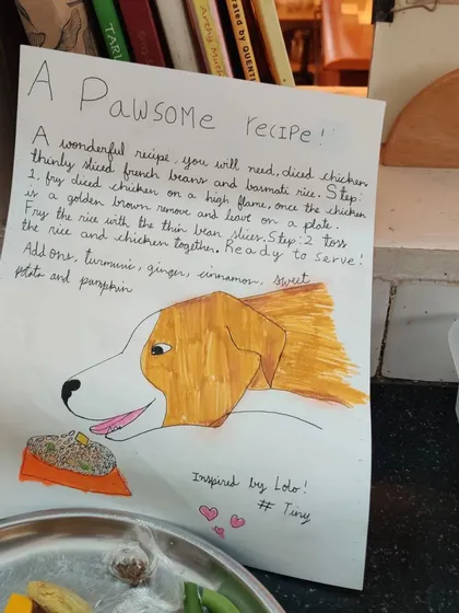 A "pawsome recipe" for our canine friends, handwritten and illustrated by a child. This shows how learning is integrated, combining writing, art, and the practical life skill of cooking.
