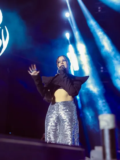 The artist Agsyworld, surrounded by stage smoke and dramatic blue spotlights. I excel at using challenging lighting conditions to create vibrant and memorable concert photos.