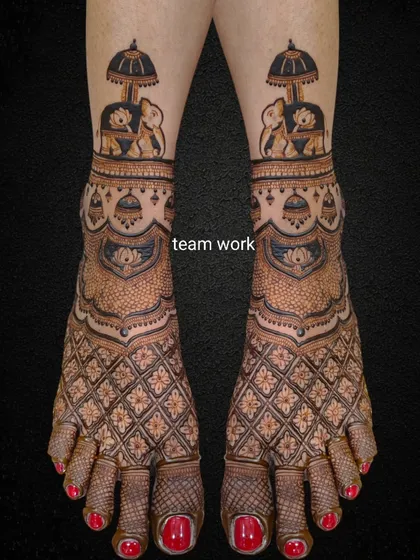 The same elephant-themed bridal foot design on a black background to highlight the intricate details.