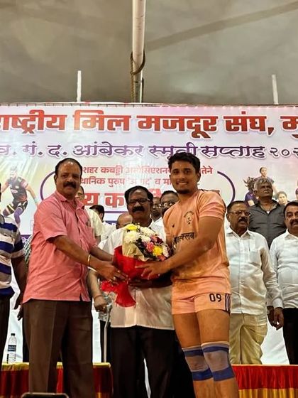 Ajinkya being felicitated on stage by the organizers for his raiding prowess.