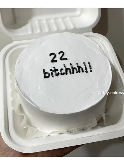 A fun and cheeky bento cake for a 22nd birthday celebration, with the message '22 bitchhh!!'.