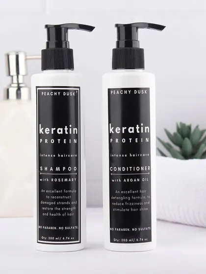 My Keratin Protein Shampoo and Conditioner duo, perfectly at home in a clean, modern bathroom setting. This sulfate-free pair is my go-to recommendation for anyone with hair damaged from coloring or heat styling, designed to gently cleanse and deeply repair.