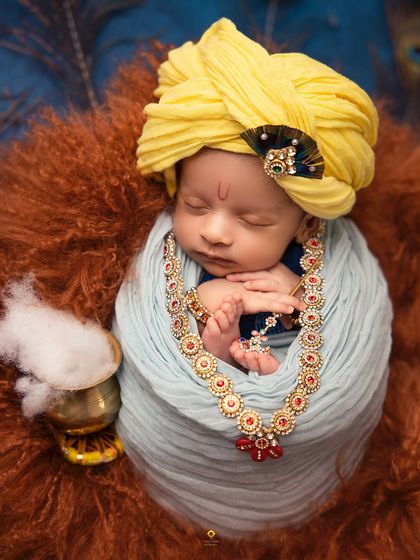 Another angle of the Little Krishna portrait, this time showing the pot of "makkhan" (butter). I love incorporating these small, symbolic props to make the theme feel complete.