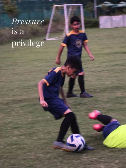Pressure is a privilege. This action shot shows a player thriving in a difficult situation, embodying the mindset we cultivate.