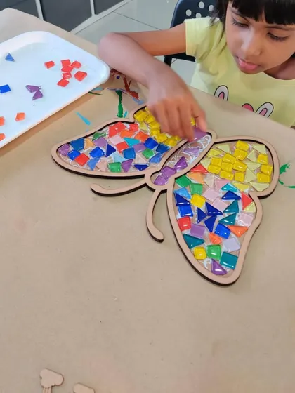 Getting hands-on with a beautiful butterfly mosaic. This sensory art activity is great for kids to explore textures and colors while creating something lovely.