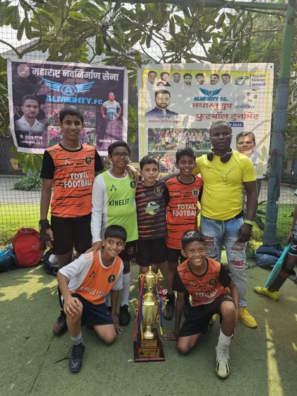The U13 champions posing with their trophy at the Almighty FC tournament. Consistent performance across age groups is our strength.