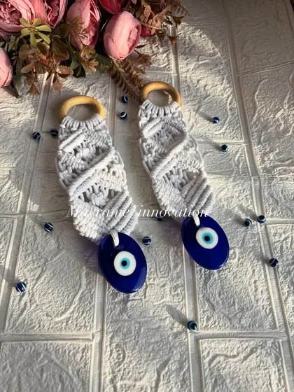 Protect your home in style with my macrame evil eye wall hanging. This piece combines traditional knotting with the powerful nazar symbol, creating a beautiful and meaningful charm to guard your space against negative energy.