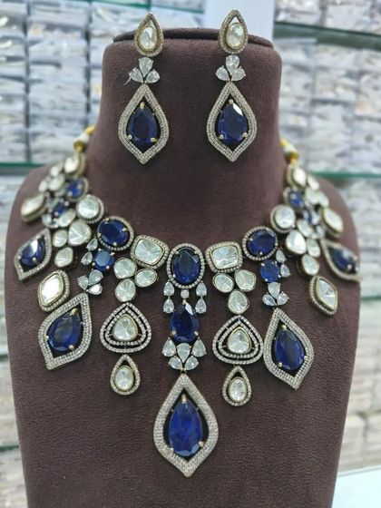 The same statement necklace design, but with deep sapphire blue stones. I can customize the stone color to your preference.