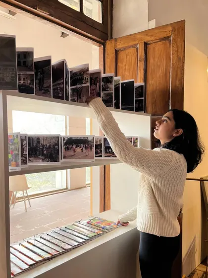 A visitor interacts with our display of publications at the Red Fort exhibition. Our goal is to make our research and practical guides widely accessible to inspire the next generation.