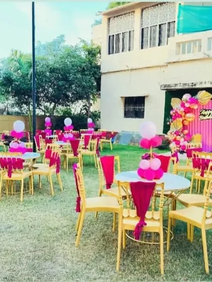 Here’s the full party view for the pink and gold birthday. I arranged the outdoor seating with matching chair sashes and table centerpieces to create a cohesive and festive environment for all the guests.