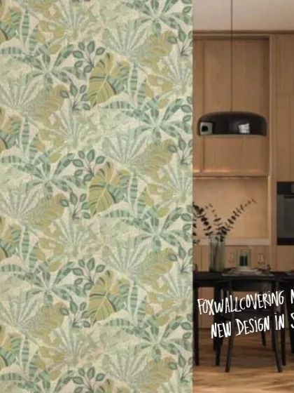 This image shows the light green tropical leaf wallpaper in a modern kitchen and dining area, demonstrating its versatility in different settings.