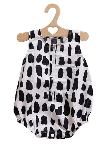 A clean product shot of our black and white 'Rocky' print romper, hanging on a cute heart-shaped hanger. It's a modern, unisex design for the stylish baby.
