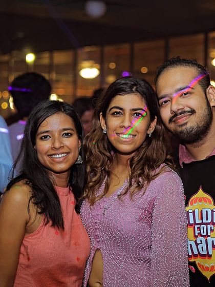 More happy faces from the dance floor, with cool lighting effects adding to the vibe.
