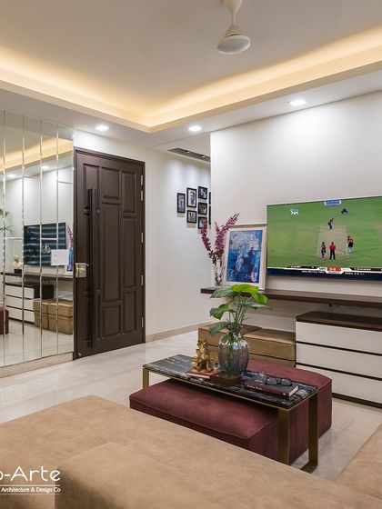 Catch every thrilling moment of the IPL in style with this cozy living room setup. The mirrored wall adds depth, while the comfortable seating ensures a perfect viewing experience.