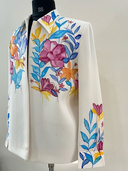 This shirt features a watercolor-style floral pattern. I used a fluid, blending technique to give the flowers and leaves a soft, ethereal quality, perfect for a carnival or festive event.