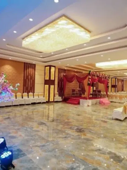A view of the spacious Sky Banquet hall in Kharghar. The marble-finish floor and modern chandeliers provide a clean and luxurious canvas for any type of event decoration.