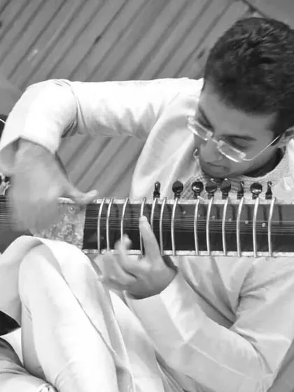 A black and white photograph from my recital at the India International Centre, capturing a timeless moment of musical dedication.