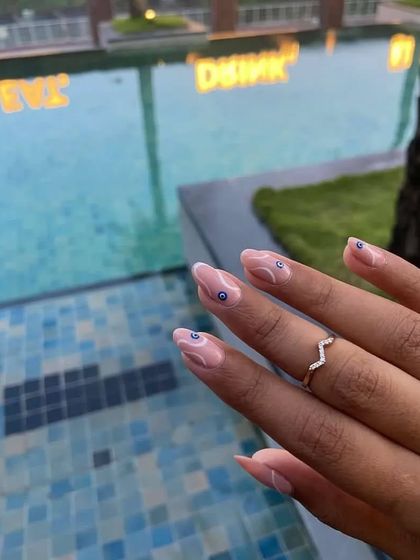 Another shot of the evil eye nails, proving they are the perfect accessory for any occasion.