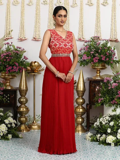The full view of the red Bandhani dress, a perfect choice for a bride's mehendi or a festive gathering.
