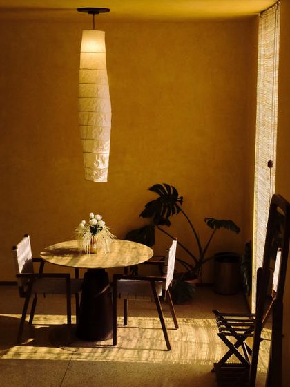 A private dining corner within a suite, offering an intimate space for meals with a view.