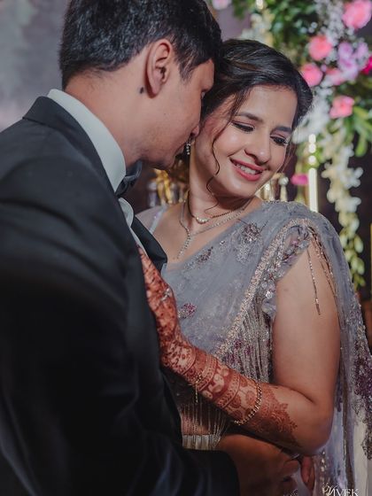 A romantic photo of the couple, where the bride's stained mehndi is a subtle but beautiful detail.