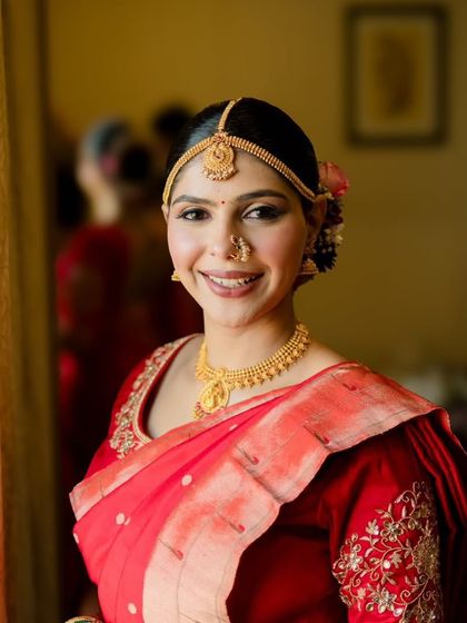 A happy, smiling portrait of the bride. Her natural-looking makeup ensures her joy shines through, making for the most beautiful pictures.