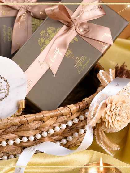 A close-up of one of my Diwali hampers, showing the personalized details like the marble coaster and custom ribbon, because every detail matters in making a gift special.