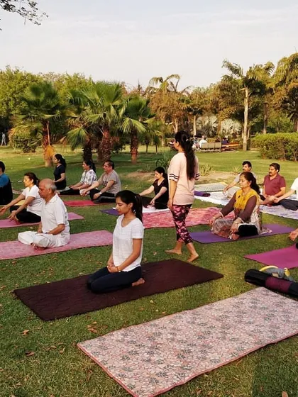 A snapshot of our yoga class in progress at the park. I provide guidance to ensure everyone is comfortable and getting the most out of their practice.