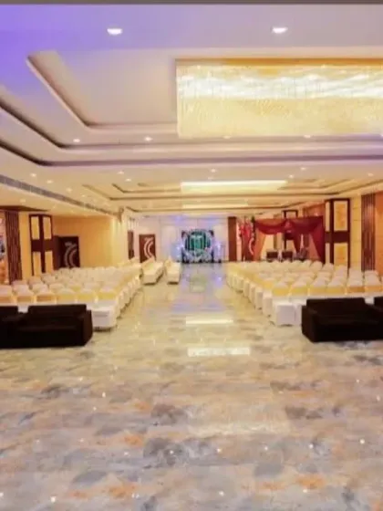 A different perspective of the Sky Banquet hall in Kharghar, showcasing the elegant chandeliers and the spacious layout before the guests arrive.
