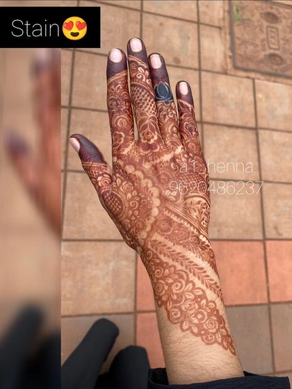 A close-up of a mature henna stain, showing the incredible detail and deep color that makes the design stand out.