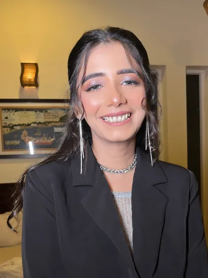 A final shot of this stunning cocktail look. The soft waves and sparkling makeup create a look that is effortlessly chic.