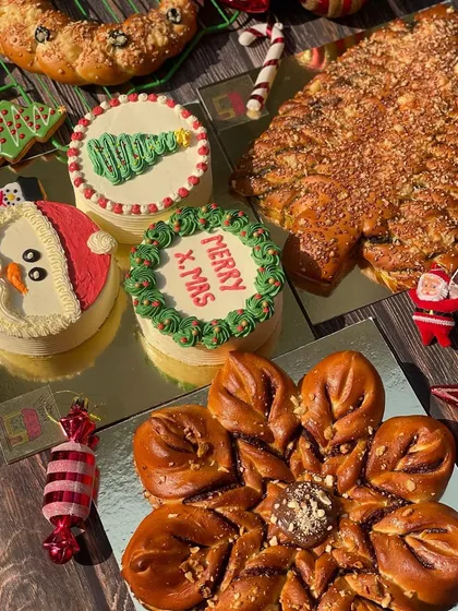 A beautiful flat lay of my Christmas collection, including bento cakes, snowflake bread, and a festive wreath bread.