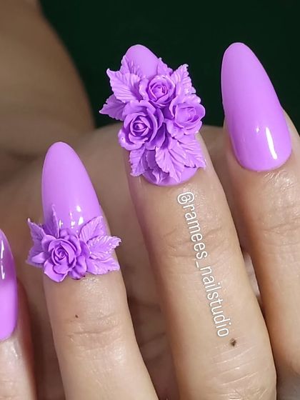 Another view of the lilac nails with 3D roses. This design is perfect for anyone who loves bold, floral, and feminine nail art.