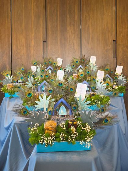 A wide shot of the impressive 'Little Kanha' themed gift display against a wooden backdrop.