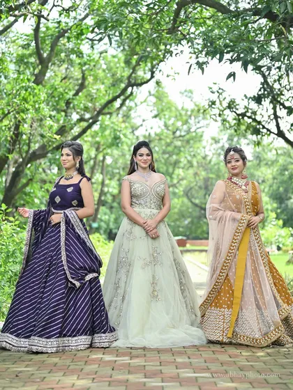 We have something for the entire bridal party. This photo shows the beautiful variety in our collection, from a modern reception gown to elegant lehengas for bridesmaids, ensuring everyone looks their best.