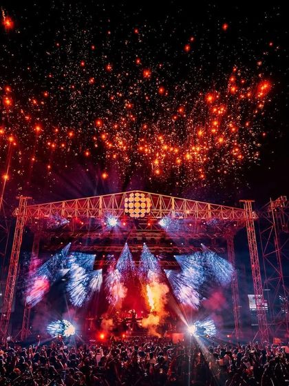 The night sky explodes with fireworks above Armin van Buuren's stage, marking the climax of an epic trance journey.