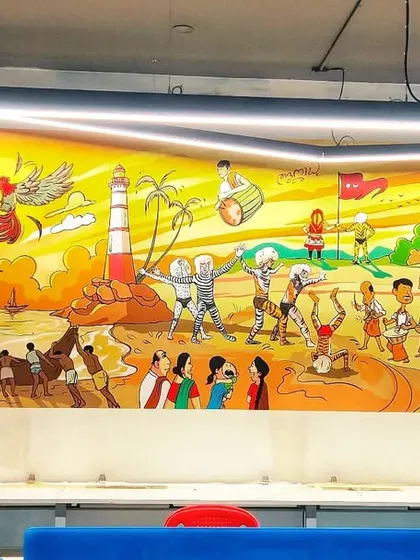 This panoramic mural was commissioned for an IT company in Mangalore's Empire Mall. It spans the length of the office, depicting a continuous narrative of coastal traditions, from Kola rituals to local beach life, bringing a piece of Mangalore's soul into a modern workspace.